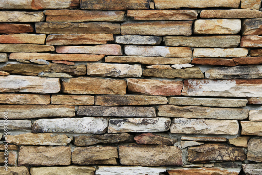 colorful tan and brown thin cut stacked stone block wall colorful tan and brown thin cut stacked stone block wall