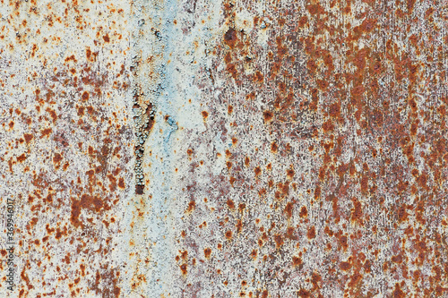 Metallic texture. A fragment of rusty metal sheet close-up.