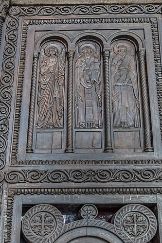 Fragments of the entrance bronze door of the Metropolitan Cathedral of the Annunciation (1862) in Metropolis square in the old town of Athens. Athens, Greece.