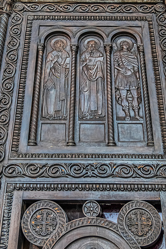 Fragments of the entrance bronze door of the Metropolitan Cathedral of the Annunciation (1862) in Metropolis square in the old town of Athens. Athens, Greece.