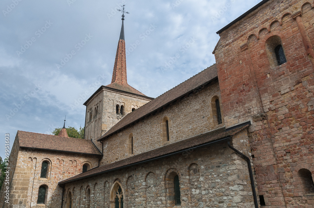 View of Romainmotier Abbey Church in Romanmontier-Envy village, one of the oldest Romanesque churches in the country, Canton Vaud, Switzerland. View of Romainmotier Abbey Church in Romanmontier-Envy village, one of the oldest Romanesque churches in the country, Canton Vaud, Switzerland.