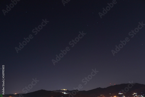 view of stars and mountain © yagizkengil