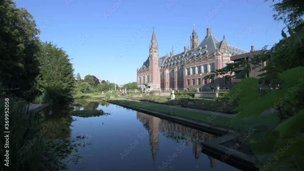 Peace Palace, one of the most visited monument in The Hague and the rose garden and its pond, Netherlands Peace Palace, one of the most visited monument in The Hague and the rose garden and its pond, Netherlands