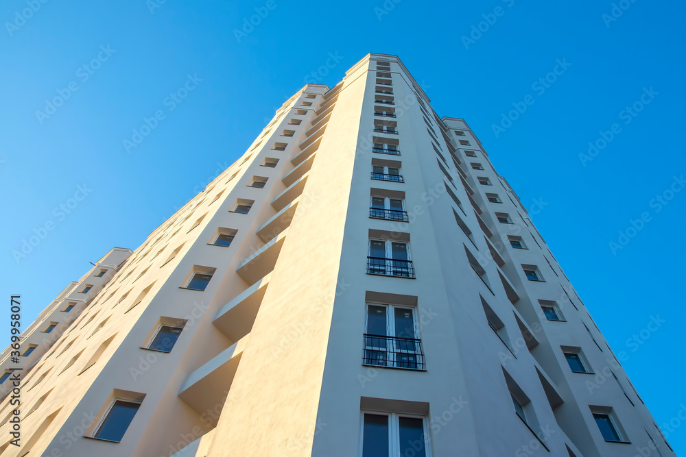 Facade of a new multi-story residential building. architecture and modern construction