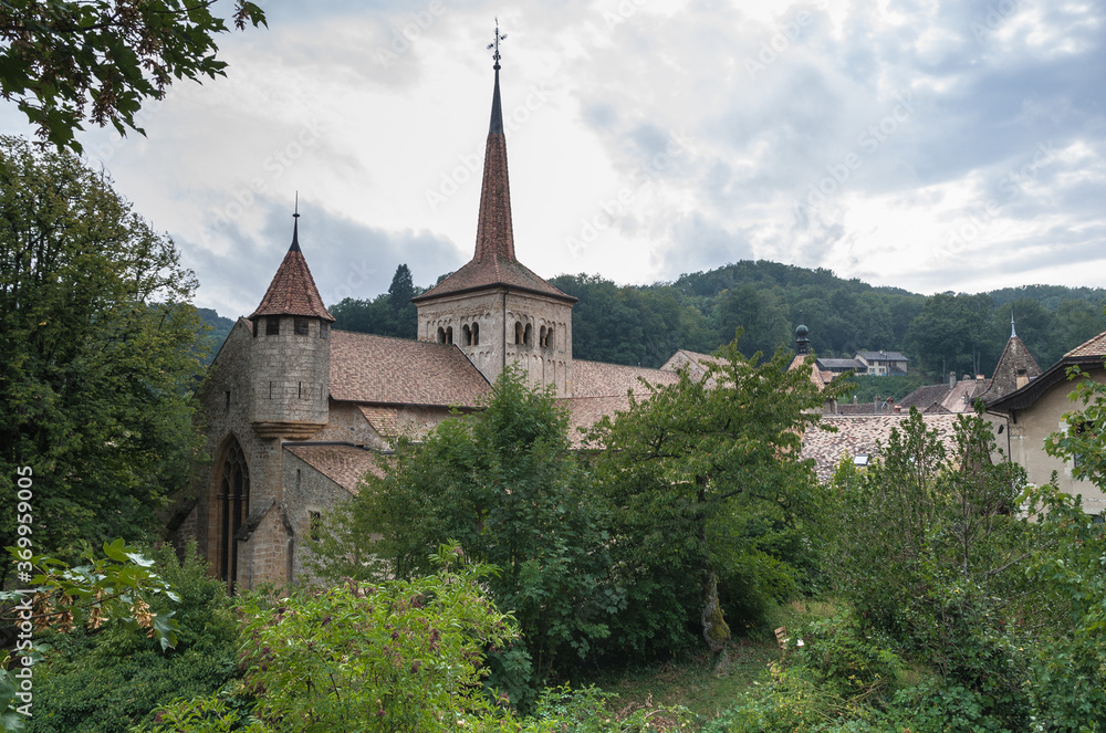 View of Romainmotier Abbey Church in Romanmontier-Envy village, one of the oldest Romanesque churches in the country,  Canton Vaud, Switzerland.