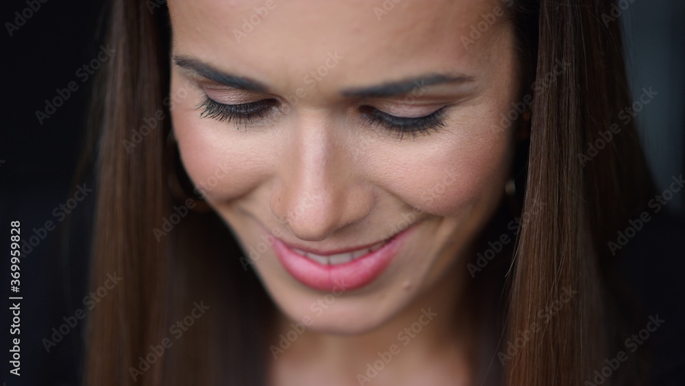 Smiling businesswoman face portrait. Closeup female entrepreneur looking down Smiling businesswoman face portrait. Closeup female entrepreneur looking down