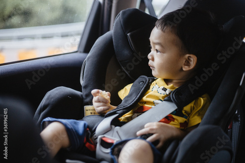 Photography 1 Year Old Adorable Asian Boy Alone Looking Around From Car Seat in the Car