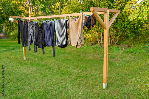 clothes hanging to dry on home made drying rack photo