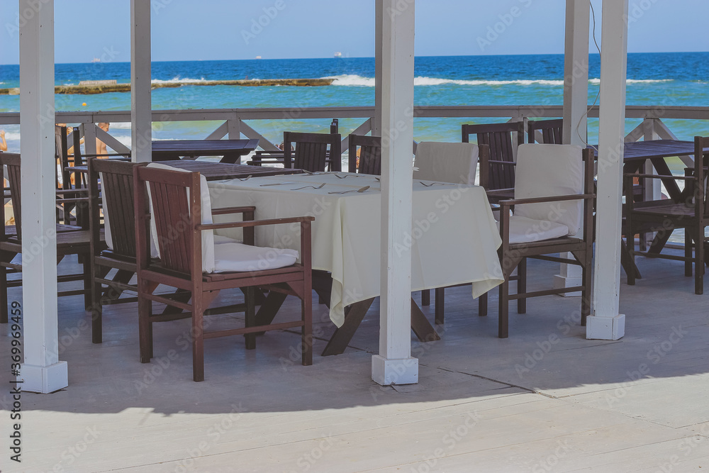 table and chairs on the beach. cafe on the beach