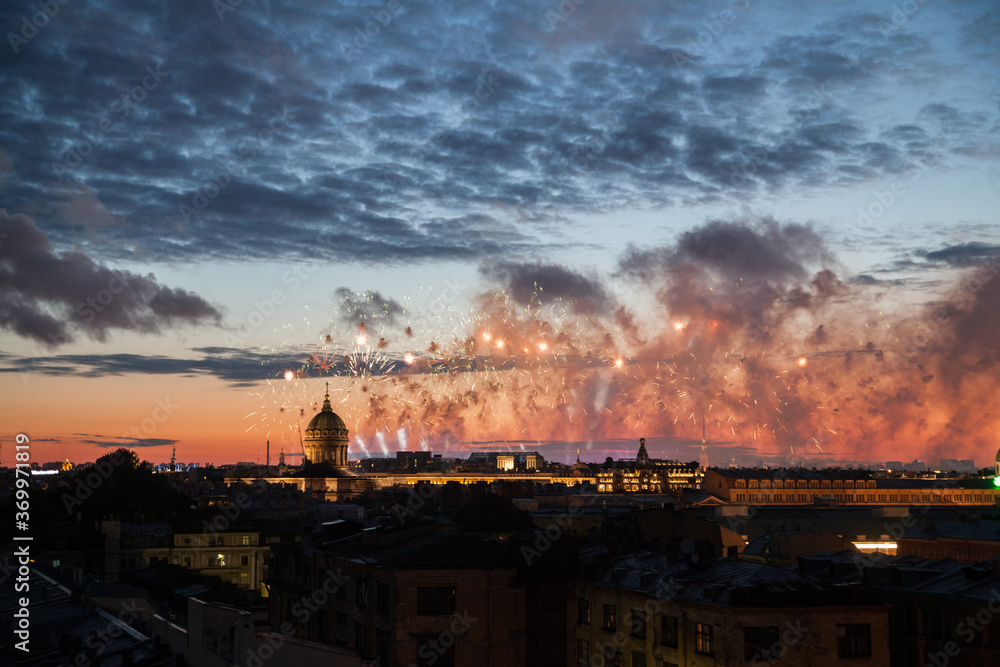 Nigt rooftop cityscape of saint petersburg with holiday fireworks