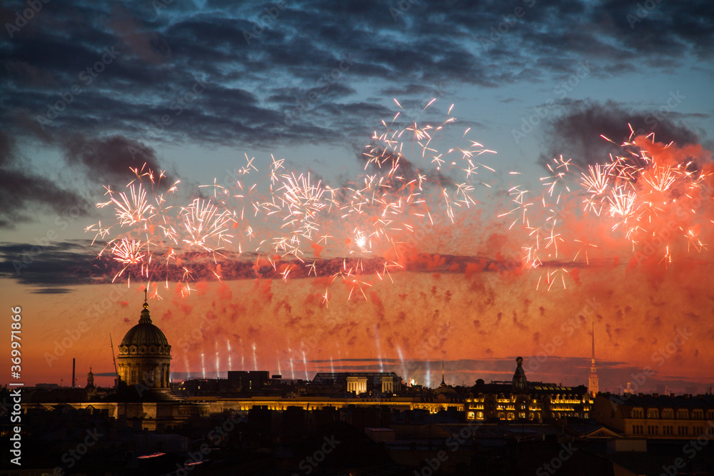 Nigt rooftop cityscape of saint petersburg with holiday fireworks