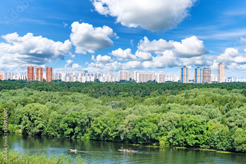 Photography picturesque moscow city skyline with residential building architecture landmark in woods and moscow river against blue sky background