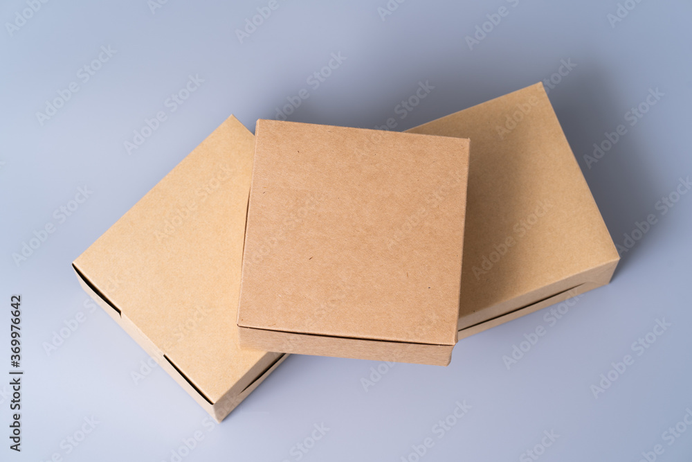 Brown paper box for food package. carton on a gray background. Brown paper box for food package. carton on a gray background.