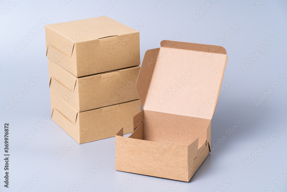 Brown paper box for food package. carton on a gray background. Brown paper box for food package. carton on a gray background.
