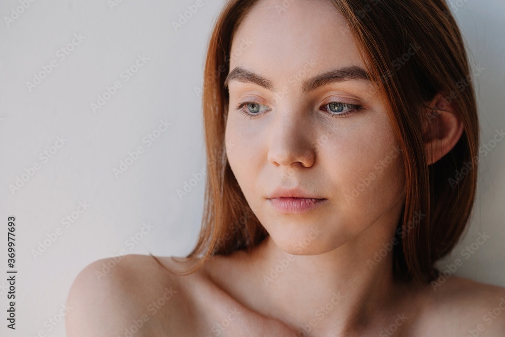 Closeup beauty portrait of young woman with natural looking make up Closeup beauty portrait of young woman with natural looking make up