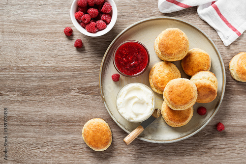Tableau sur toile Scones with raspberry jam and clotted cream.