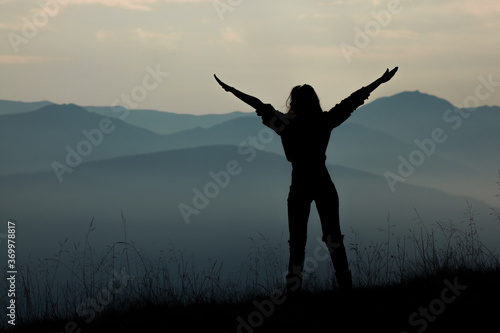 girl tourist high in the mountains