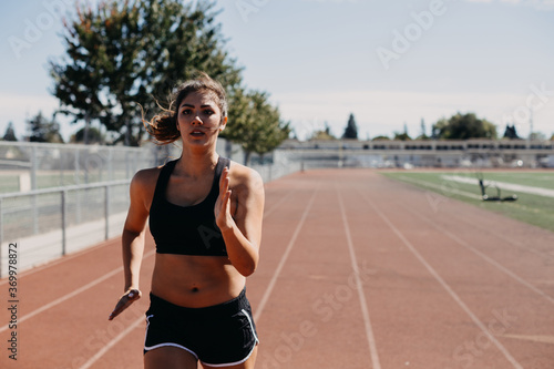 Woman Sprinting on Track photo