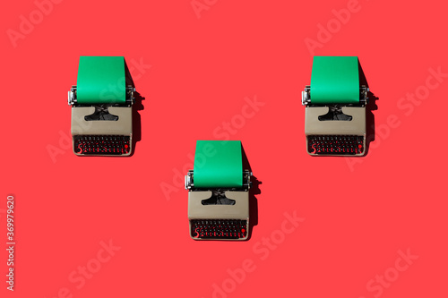 Typewriters on Red Backdrop photo