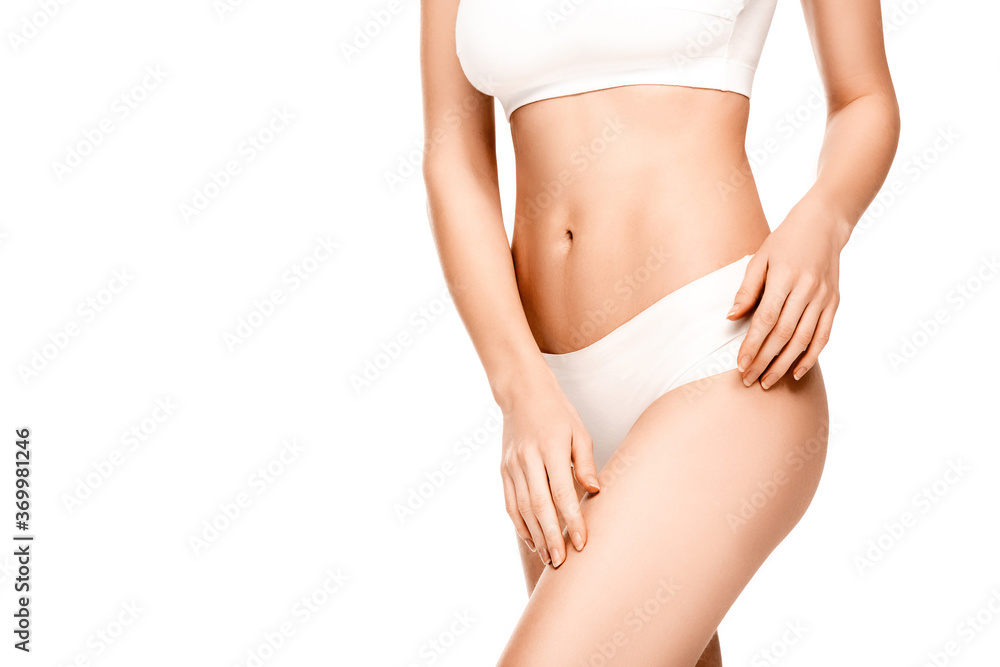 cropped view of young woman in panties and top standing isolated on white