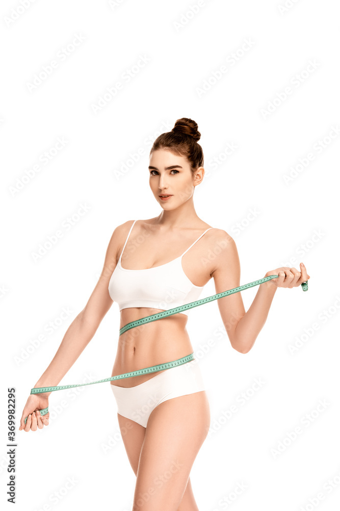 woman measuring waist with measuring tape isolated on white