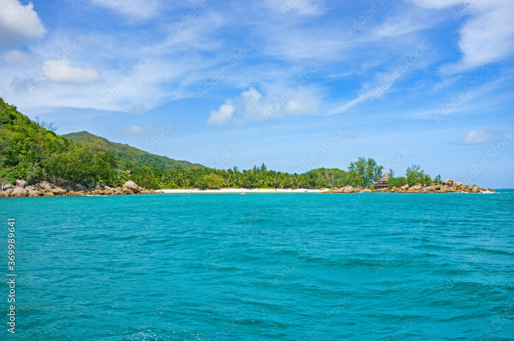 Shoreline of a tropical island in the Seychelles and view of the Ocean