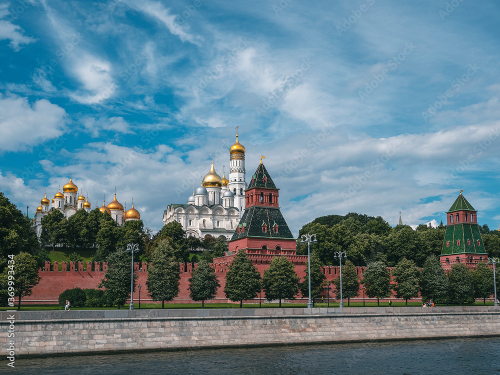 Obraz premium Beautiful view of Moscow. Kremlin embankment on a summer day. Towers Of The Moscow Kremlin. Bell Tower Of Ivan The Great. Churches in Moscow