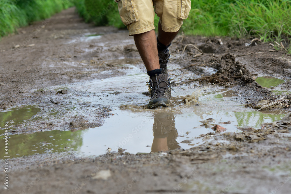 Walking with boots through a puddle Walking with boots through a puddle