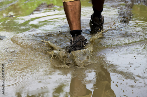 Walking with boots through a puddle