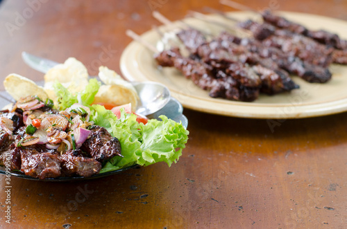 Beef satay with peanut sauce, indonesian skewer cuisine
