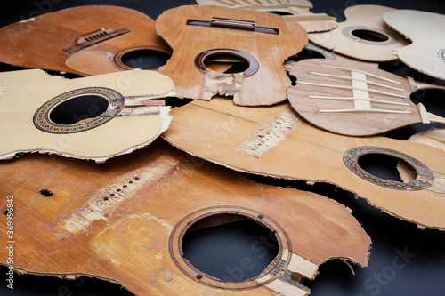 Old parts of broken guitars photo