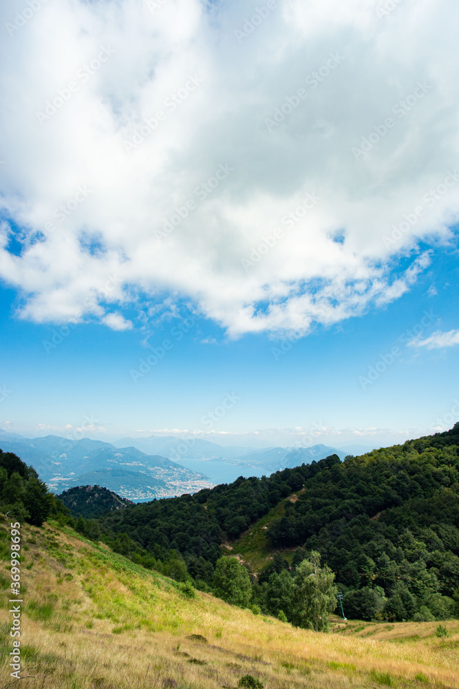 panorama from the top of mount mottarone in italy with a view of the valley below panorama from the top of mount mottarone in italy with a view of the valley below