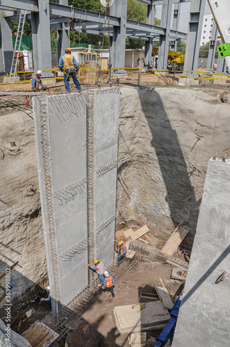 Positioning a huge construction surrounding wall or tilt-up panel
Construction frame made of reinforced precast concrete and steel rods
 photo