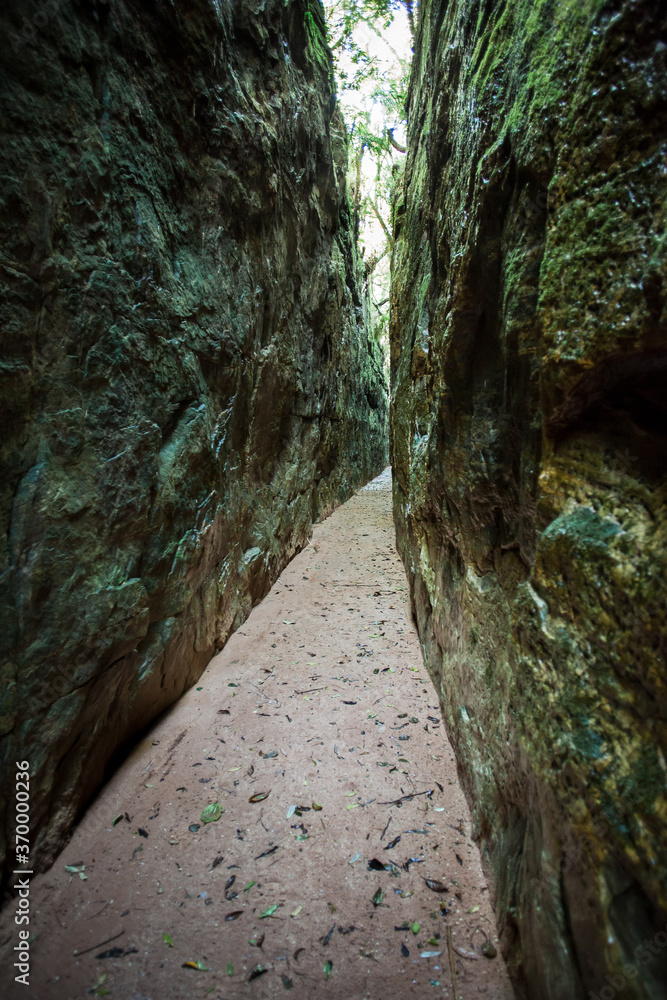 A cleft in a huge block of rock, made a path with 1km (0.6mi) long, between two stone walls with about 50 to 100ft high, separated by only 16ft - Guartela - Tibagi - Brazil