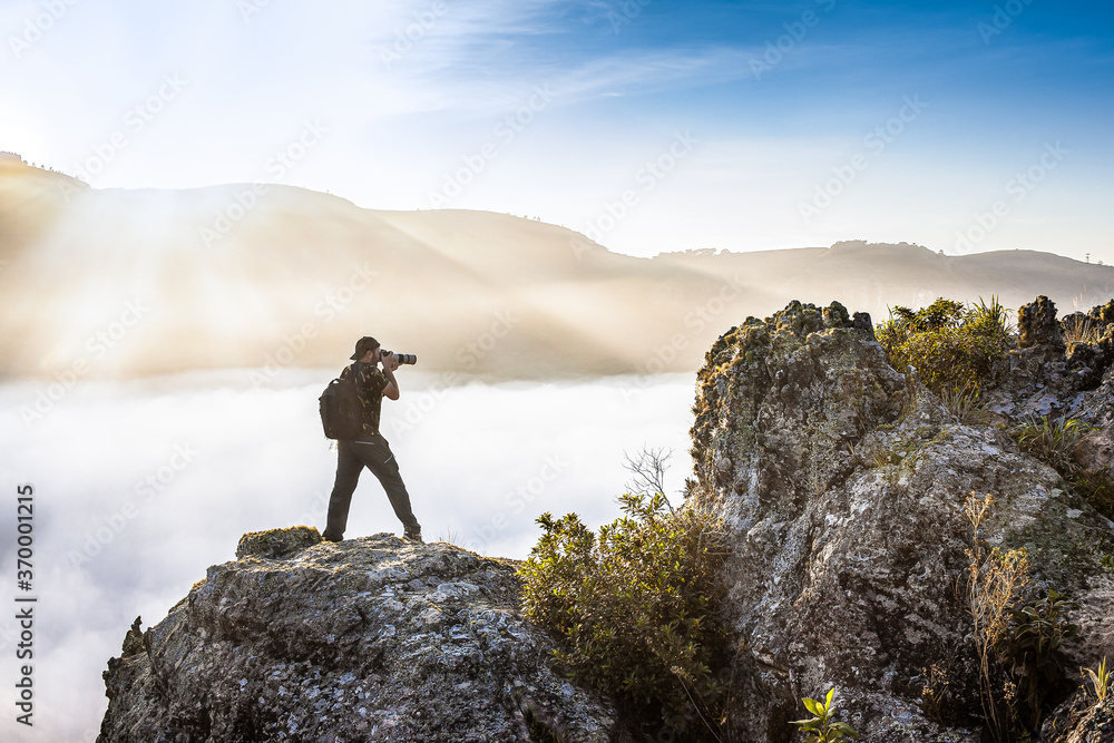 Man with backpack shooting above the clouds - Guartela Canyon - Tibagi/ PR - Brazil