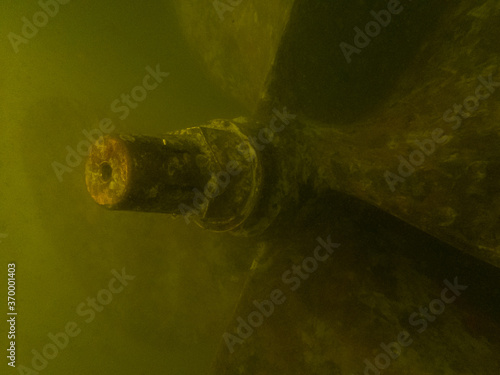 Fishing trawler propeller in murky water