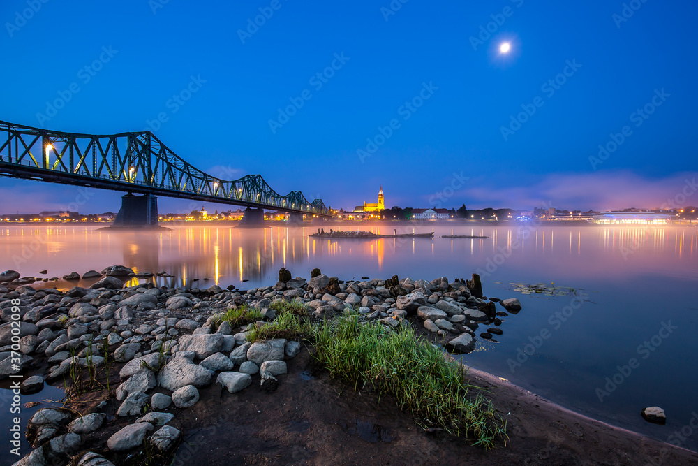 bridge over Vistula river in early misty morning. Wloclawek, Poland