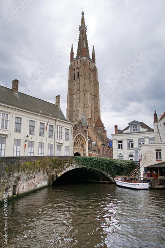 View of Bruges medieval cityscape and Our Lady tower. Church of Our Lady.