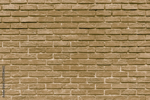 The background of the old beige brick wall for design interior