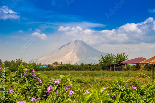 A view of Mount Sinabung over agricultural land in North Sumatra, Indonesia
