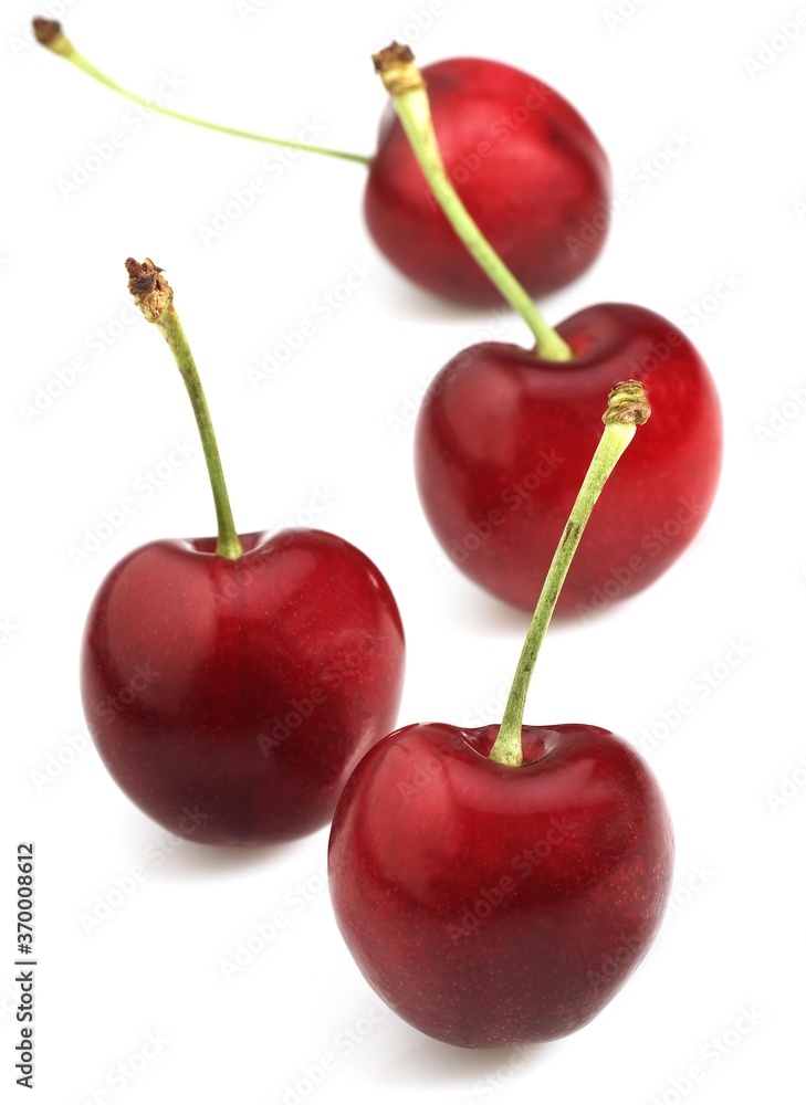 BIGARREAU CHERRIES (FRENCH SPECY) AGAINST WHITE BACKGROUND BIGARREAU CHERRIES (FRENCH SPECY) AGAINST WHITE BACKGROUND