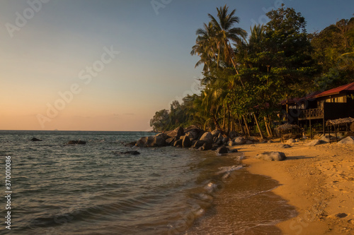 The sun shining on Melina Beach at sunset, Tiomen Island, Malaysia