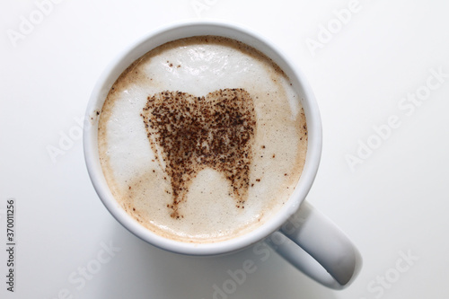 coffe cup with froth and tooth pattern top view