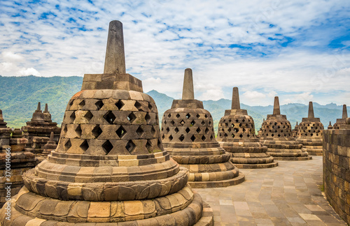 Stupas that look like bells on top of the Borobudur Buddhist temple, Indonesia