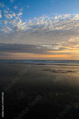 Sunset at beautiful beach at Canoa  pacific coast  Puerto Lopez  Manat    Ecuador  vertical 