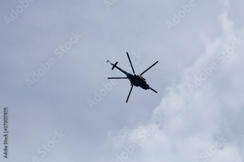 helicopter against the blue sky