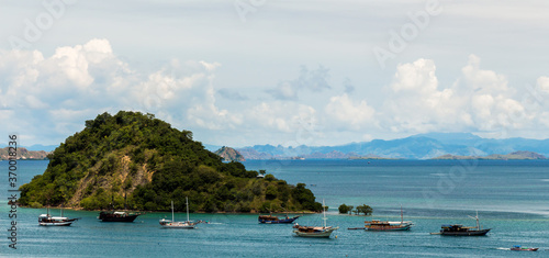Palua Pungua Besar island and boats near Labuan Bajo, Flores, Indonesia photo