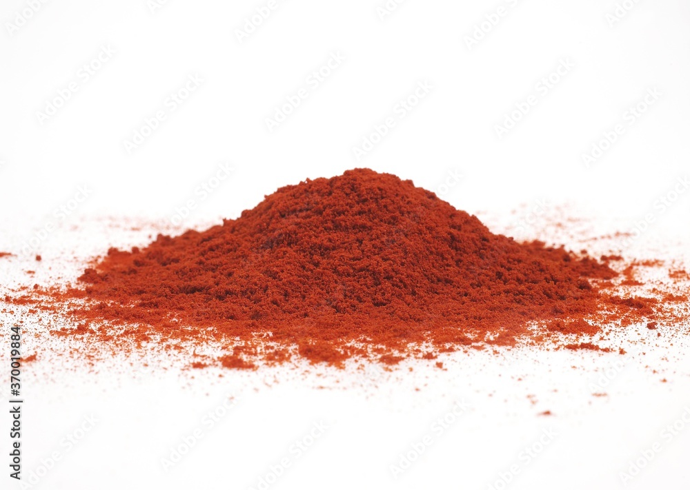 PAPRIKA POWDER AGAINST WHITE BACKGROUND