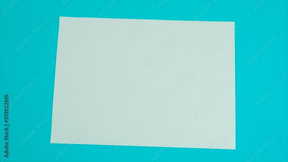 Crumpled paper on a blue background, stop-motion animation Crumpled paper on a blue background, stop-motion animation