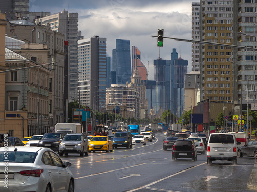 Moscow traffic of cars. Novy Arbat Street in rainy summer day